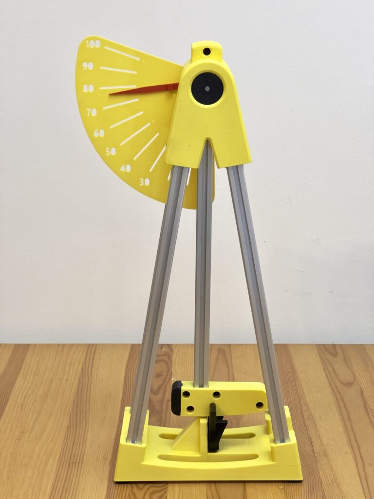 3D printed pendulum impact test stand with a release arm and mechanical scale used for Izod and Charpy comparisons